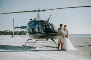 Tourist having a moment on a luxury Tanzania helicopter Zanzibar Honeymoon